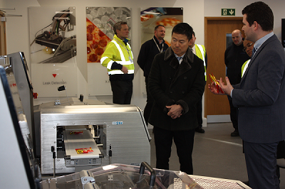 Mr Ishida Looking At Machine